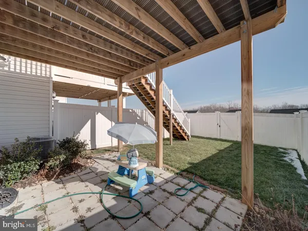 a patio with table and chairs