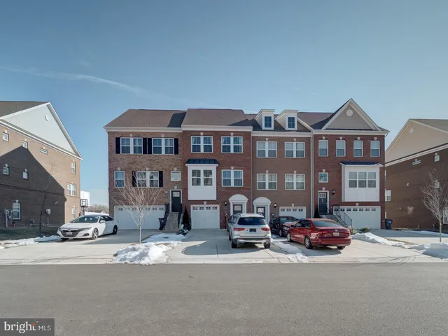 a front view of a building with parking