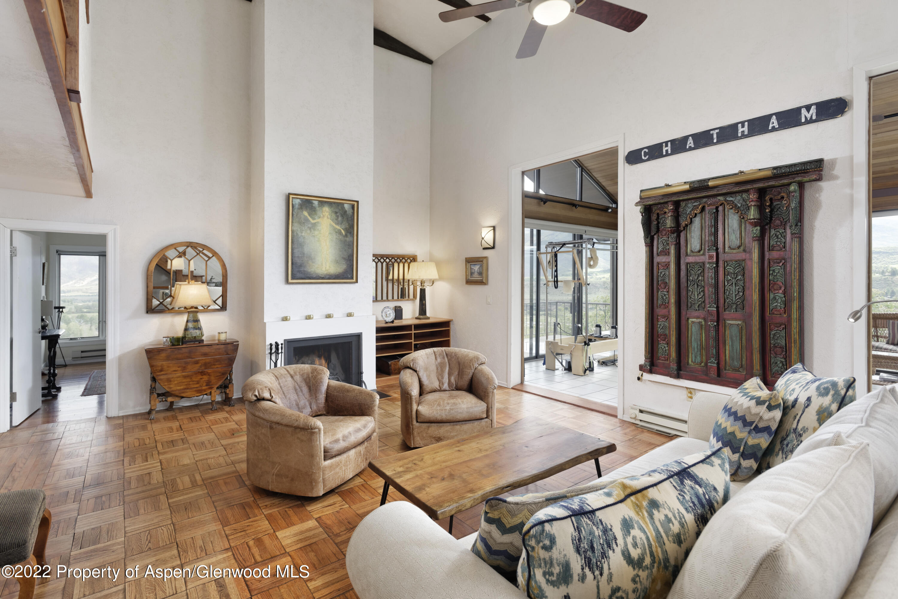 540 Upper Ranch Road Aspen, CO 81611 - Photo 2 of 24 a living room with furniture fireplace and a chandelier