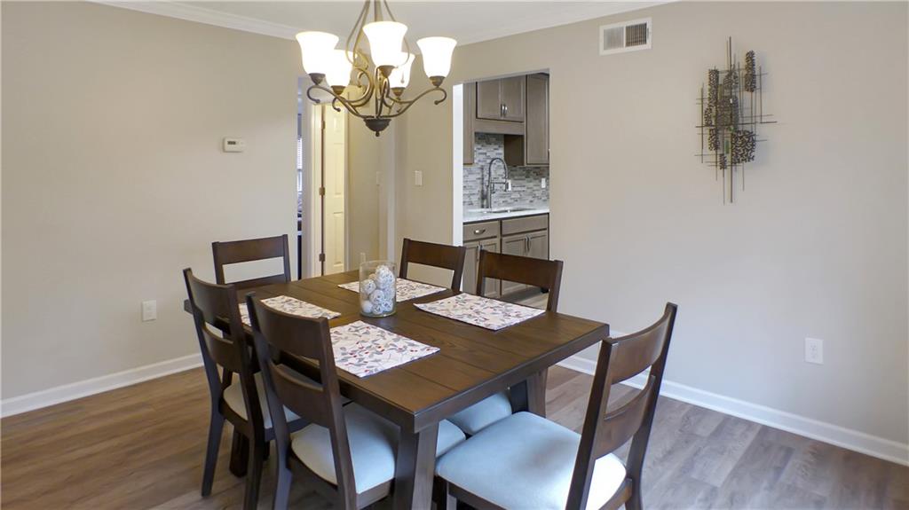 130 Terra Drive McKees Rocks, PA 15136 - Photo 13 of 38 a view of a dining room with furniture and wooden floor