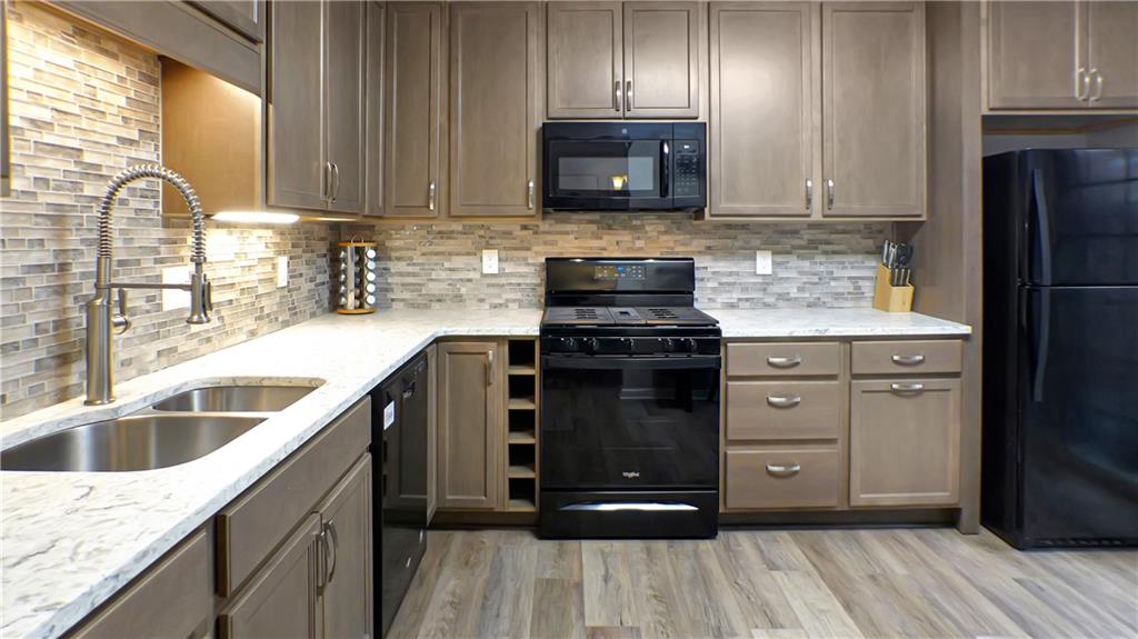 130 Terra Drive McKees Rocks, PA 15136 - Photo 28 of 38 a kitchen with a sink stove and microwave