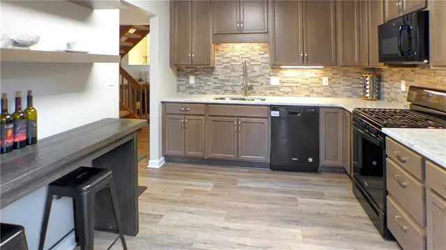 a room with pool table and windows