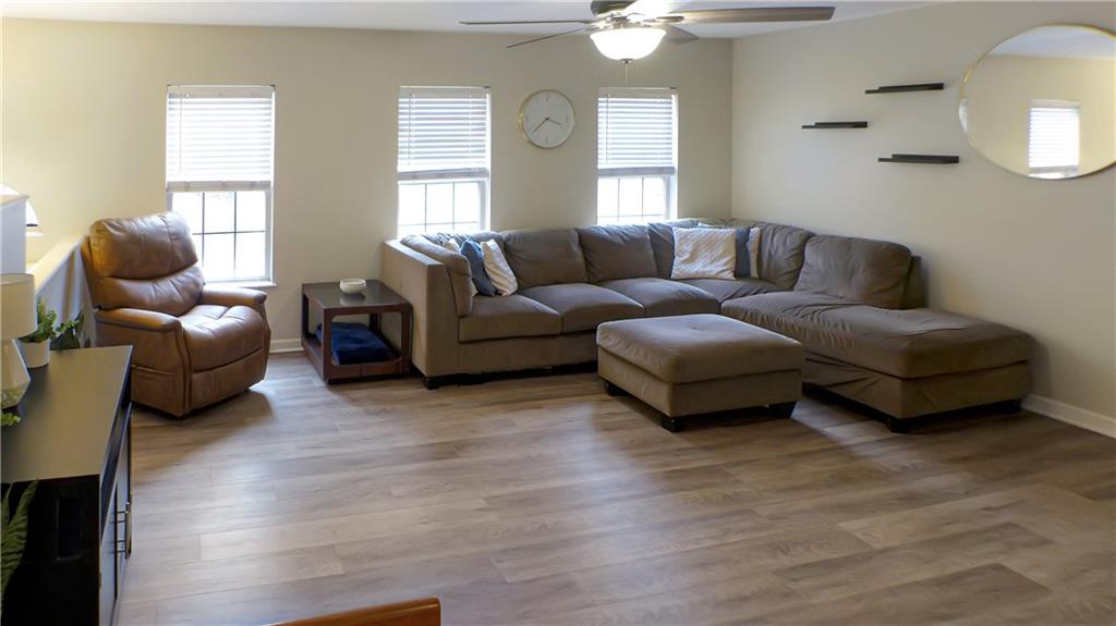 130 Terra Drive McKees Rocks, PA 15136 - Photo 3 of 38 a living room with furniture and a large mirror next to a window