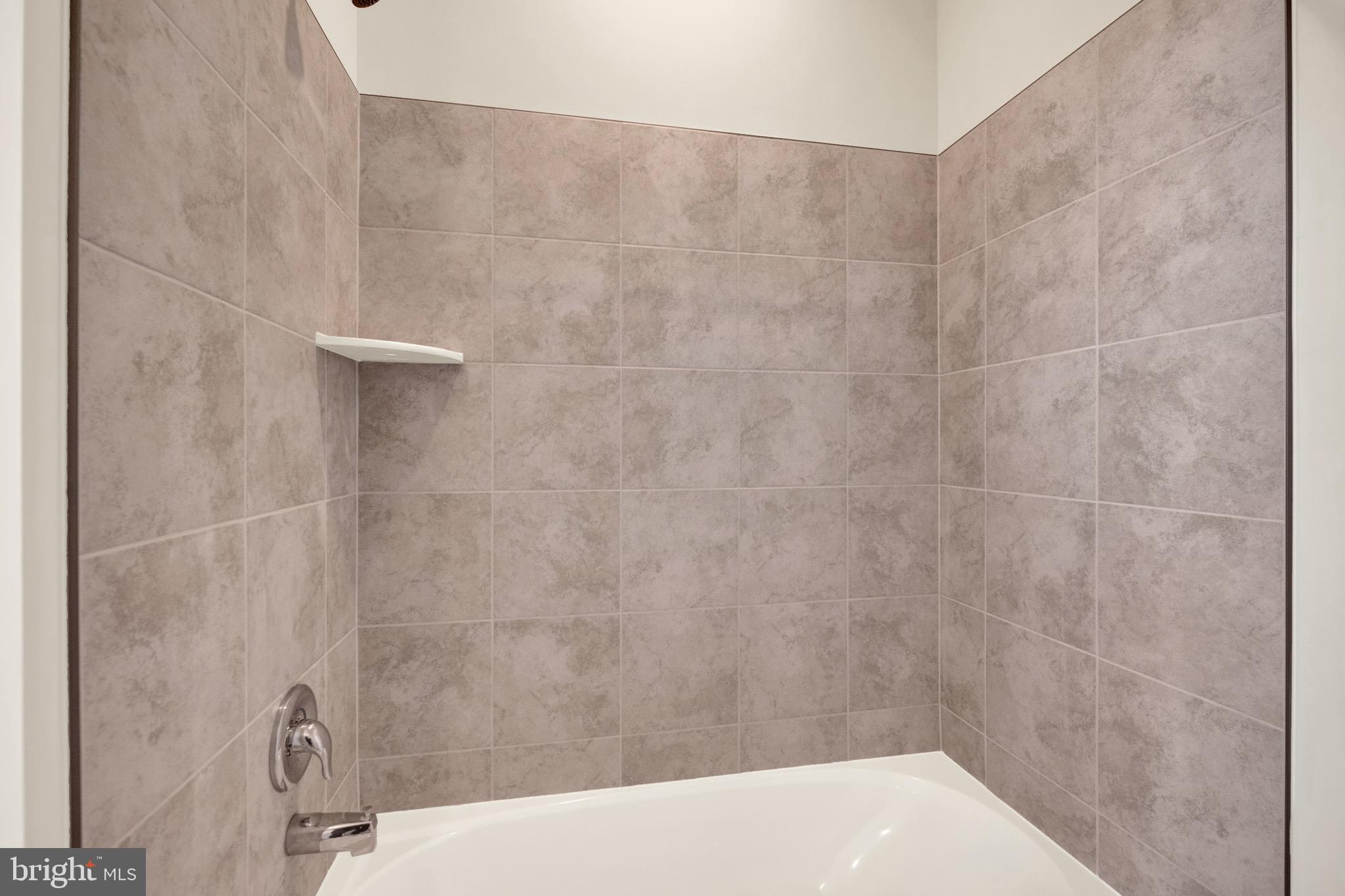 614 Mountain Laurel Boulevard Ranson, WV 25438 - Photo 14 of 28 a bathroom with a shower