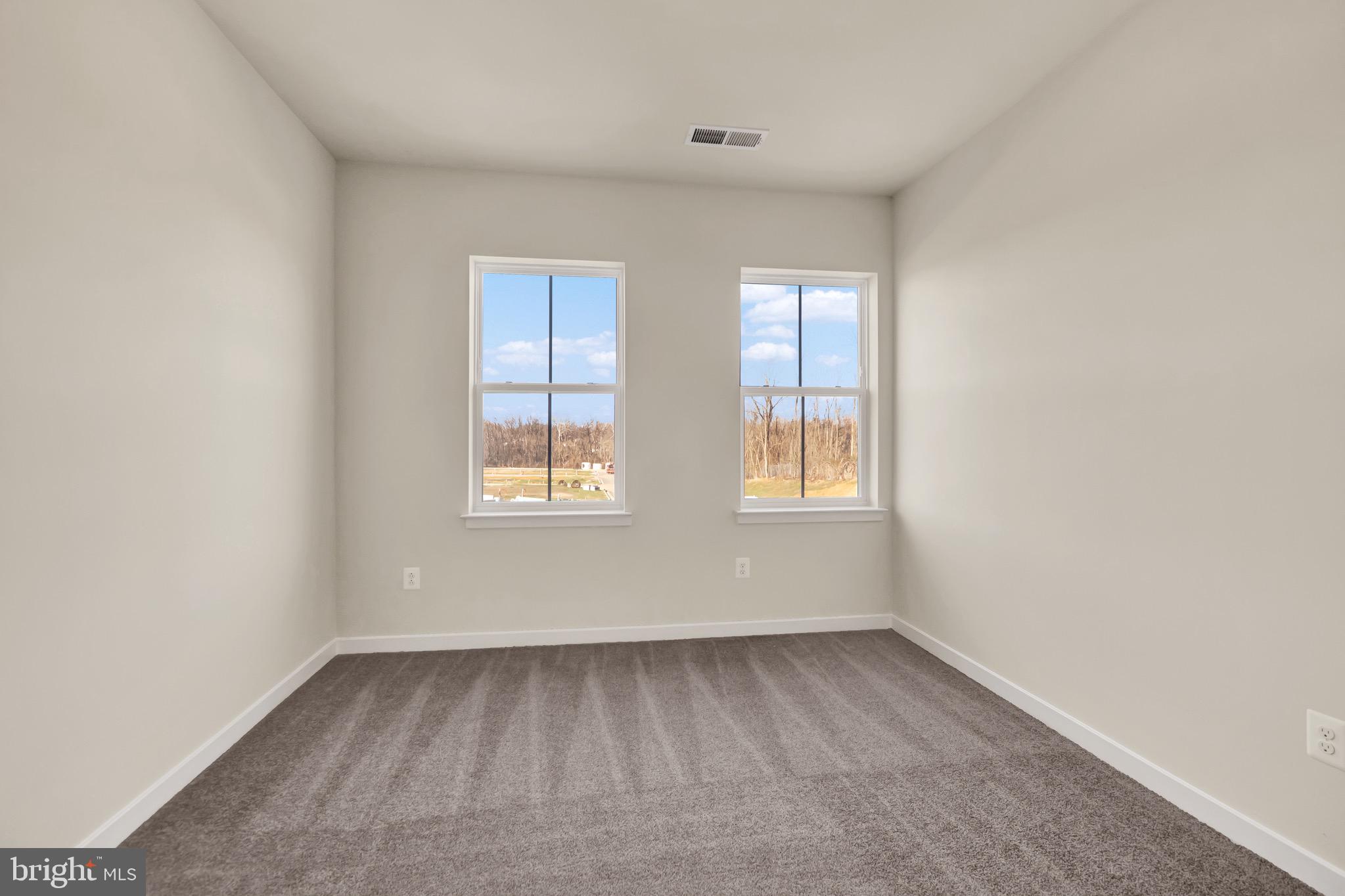 614 Mountain Laurel Boulevard Ranson, WV 25438 - Photo 15 of 28 an empty room with windows