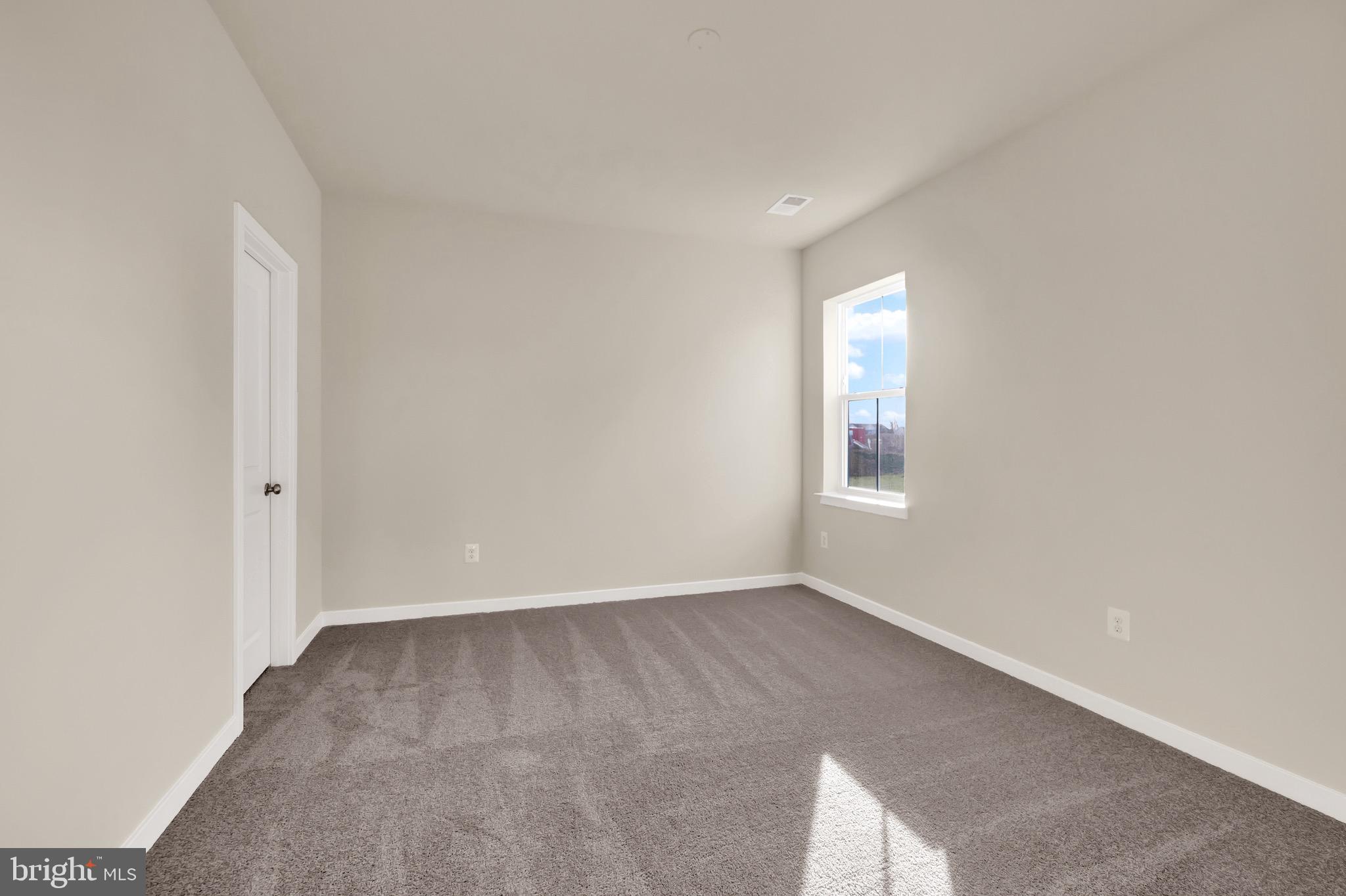 614 Mountain Laurel Boulevard Ranson, WV 25438 - Photo 17 of 28 an empty room with a window