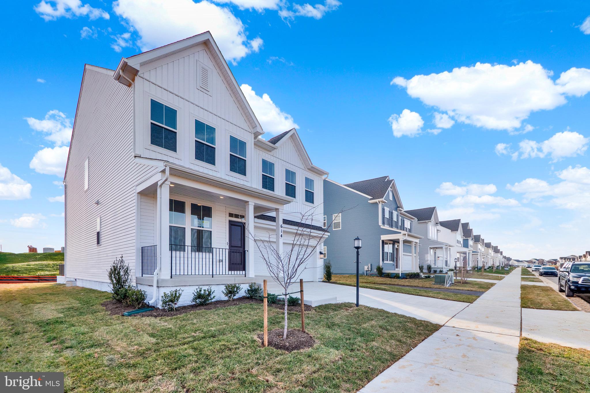 614 Mountain Laurel Boulevard Ranson, WV 25438 - Photo 2 of 28 a view of a house with a yard
