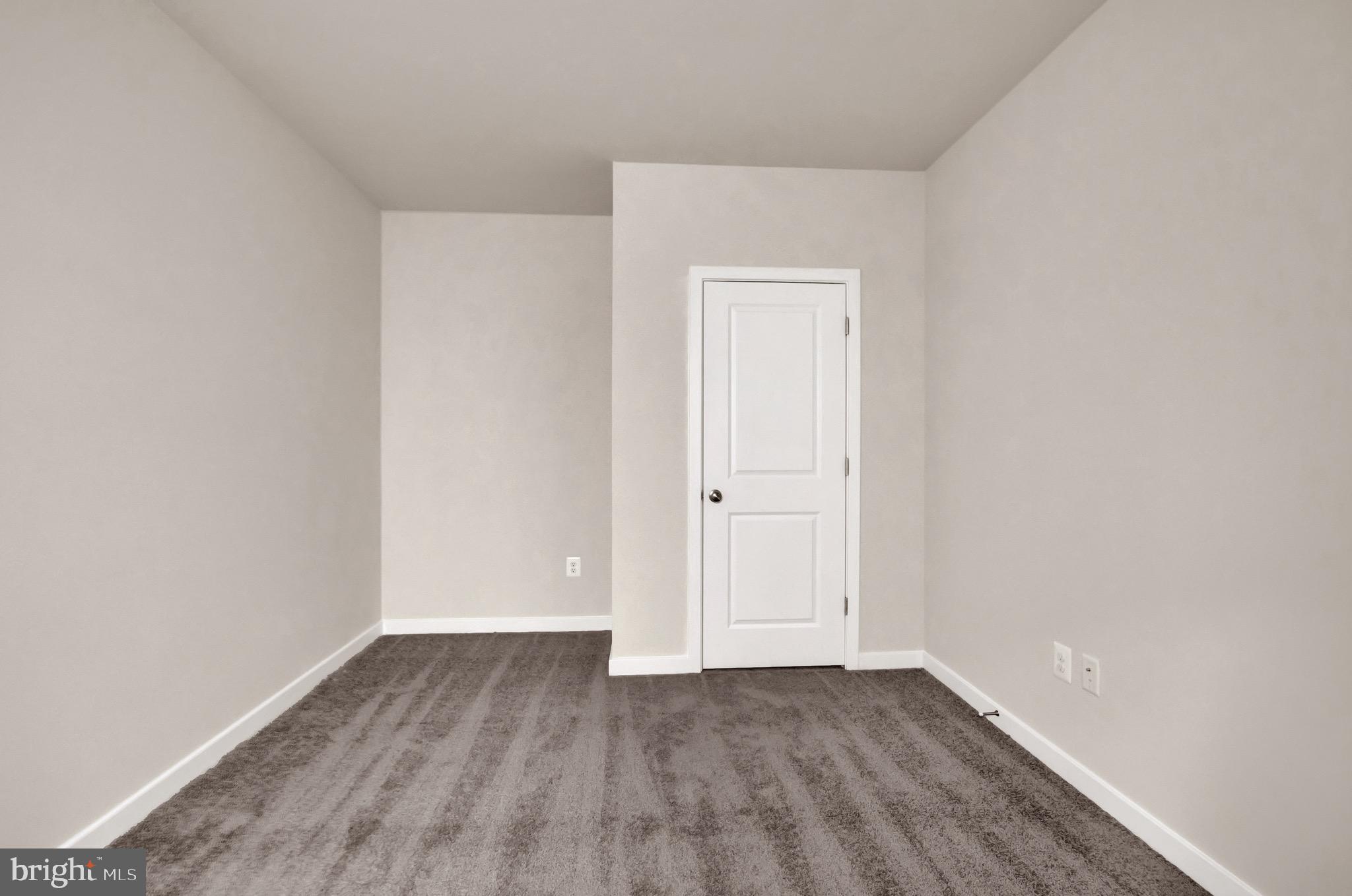 614 Mountain Laurel Boulevard Ranson, WV 25438 - Photo 27 of 28 a view of an empty room with wooden floor