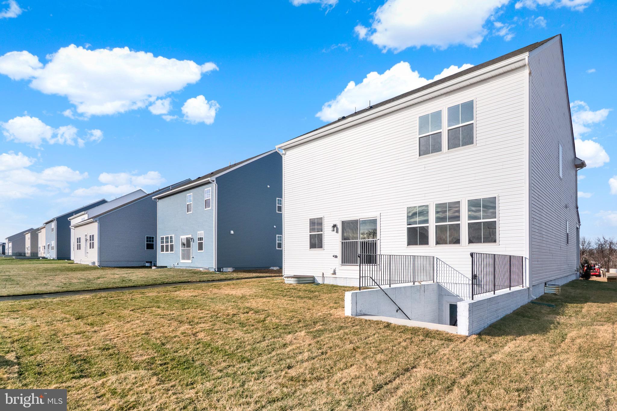 614 Mountain Laurel Boulevard Ranson, WV 25438 - Photo 3 of 28 a front view of a house with large windows