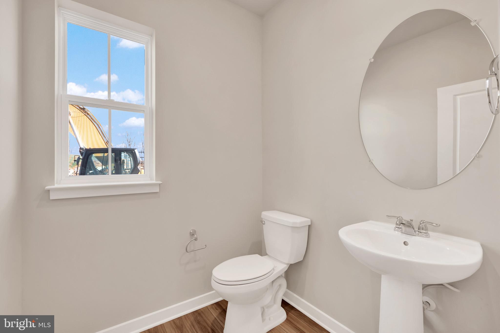 614 Mountain Laurel Boulevard Ranson, WV 25438 - Photo 5 of 28 a bathroom with a sink and a toilet
