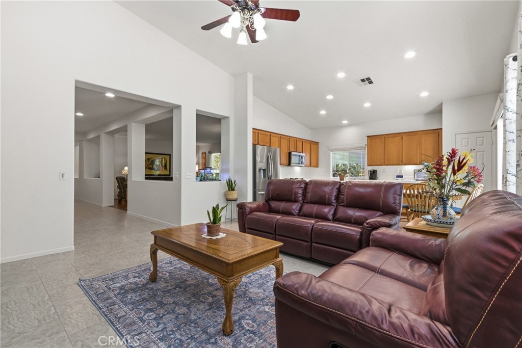 33145 Vermont Road Temecula, CA 92592 - Photo 11 of 41 a living room with furniture and a rug