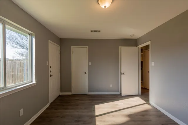 a view of an empty room and window