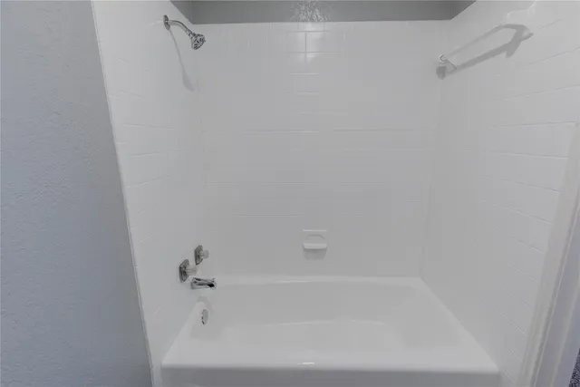 a close view of a bathtub in bathroom