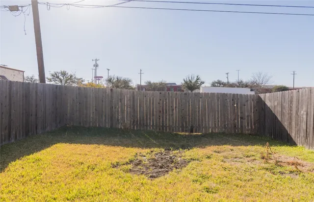 a view of a backyard of the house