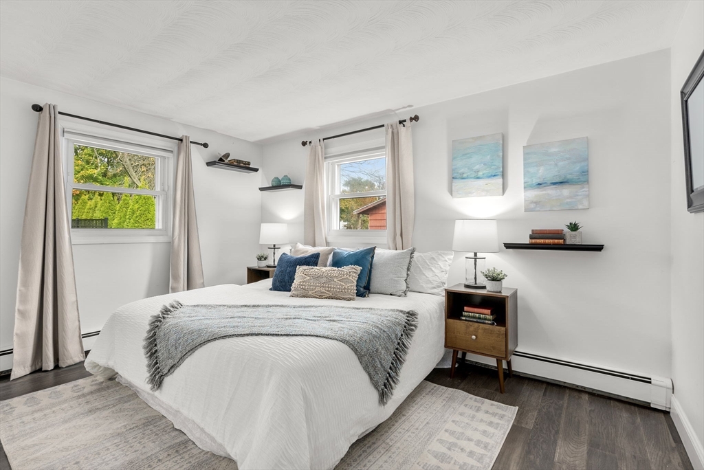 62 Gregory Road Framingham, MA 01701 - Photo 11 of 24 a bedroom with a bed and wooden floor