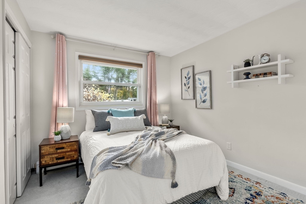 62 Gregory Road Framingham, MA 01701 - Photo 12 of 24 a bedroom with a bed and a window