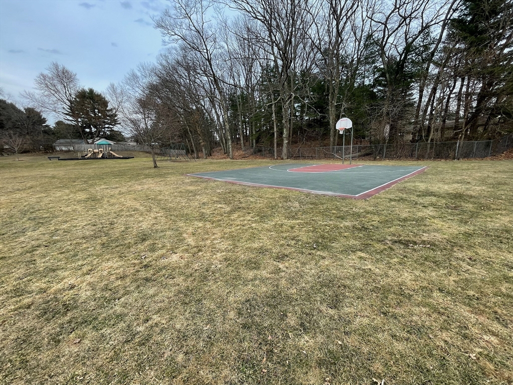 62 Gregory Road Framingham, MA 01701 - Photo 23 of 24 a view of outdoor space with deck and trees