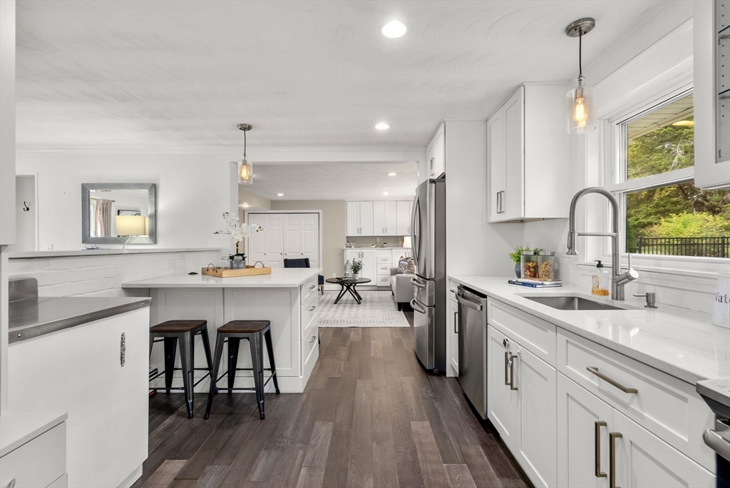62 Gregory Road Framingham, MA 01701 - Photo 5 of 24 a kitchen with a sink a counter space appliances and cabinets