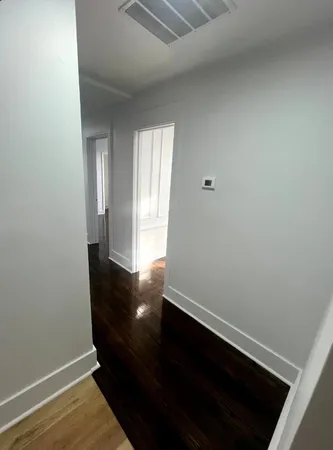 a view of small space with wooden floor