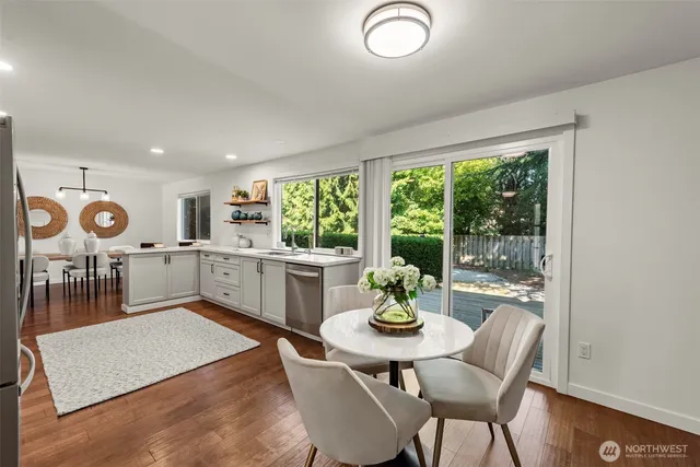 a open dining room with furniture and window