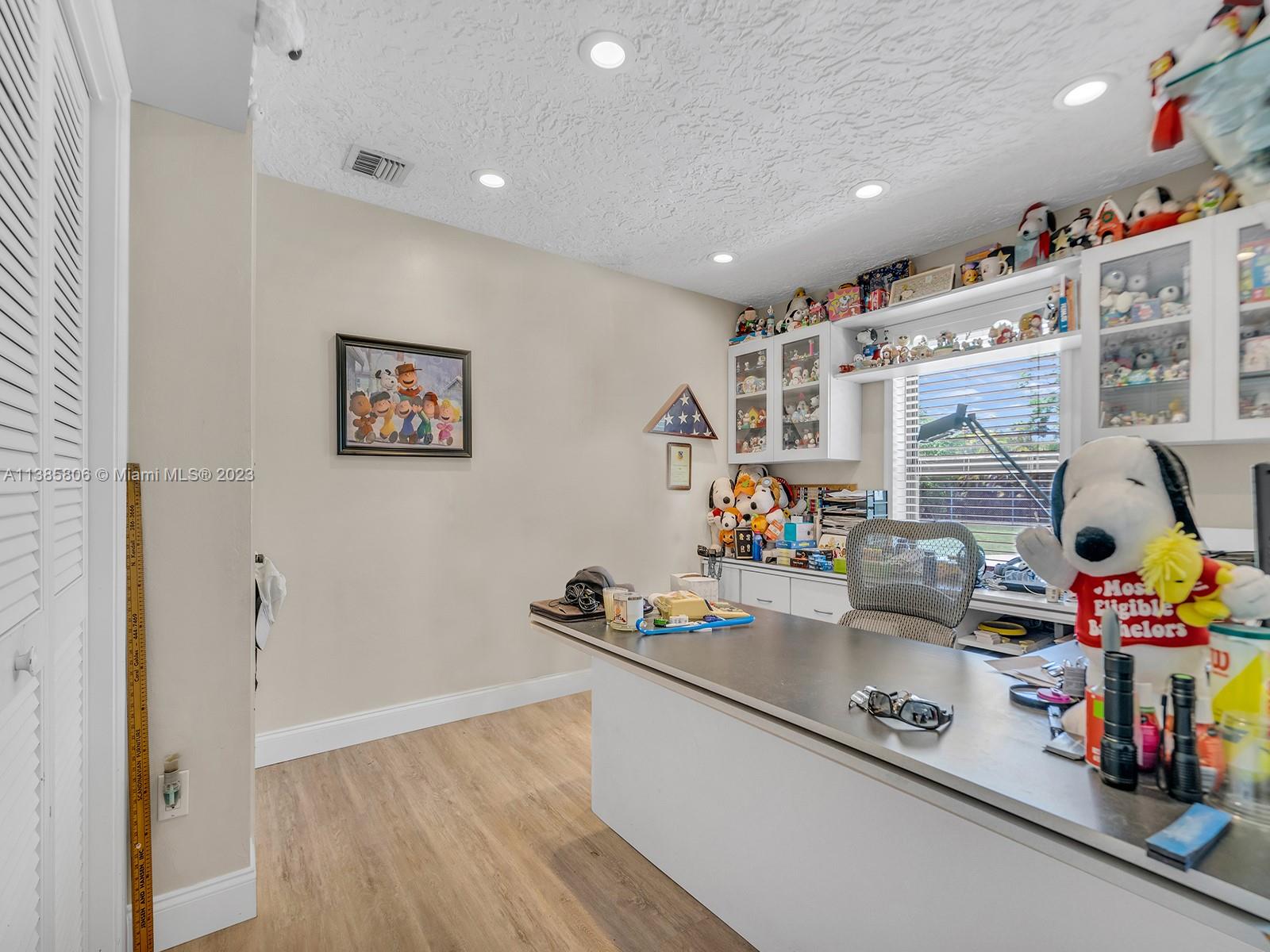 14900 Southwest 250th Street Homestead, FL 33032 - Photo 17 of 34 a kitchen that has a lot of cabinets and couch