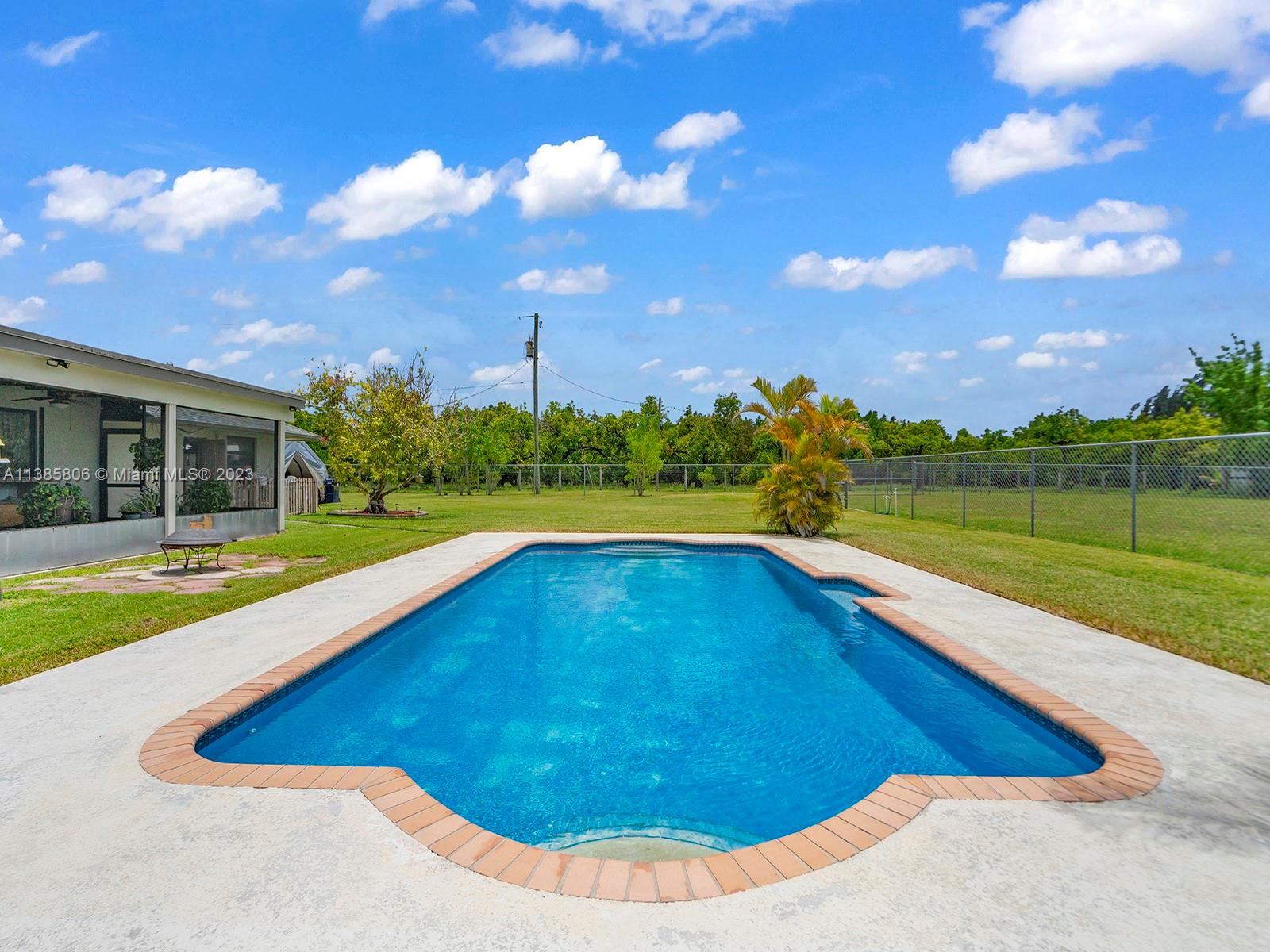 14900 Southwest 250th Street Homestead, FL 33032 - Photo 23 of 34 a view of swimming pool is middle in the garden