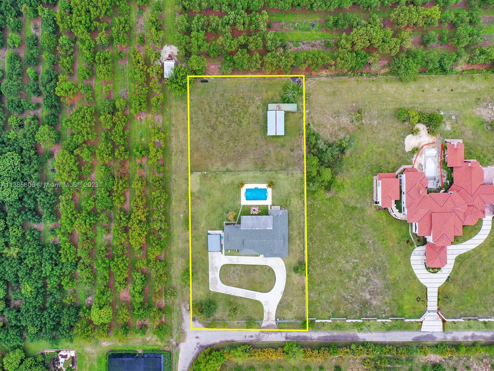 14900 Southwest 250th Street Homestead, FL 33032 - Photo 32 of 34 an aerial view of a house with outdoor space