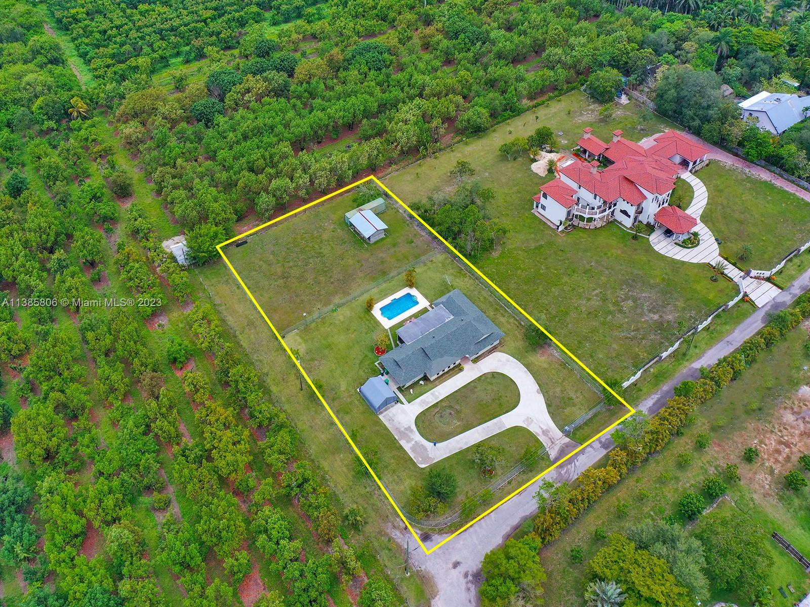 14900 Southwest 250th Street Homestead, FL 33032 - Photo 34 of 34 an aerial view of a tennis ground and large trees