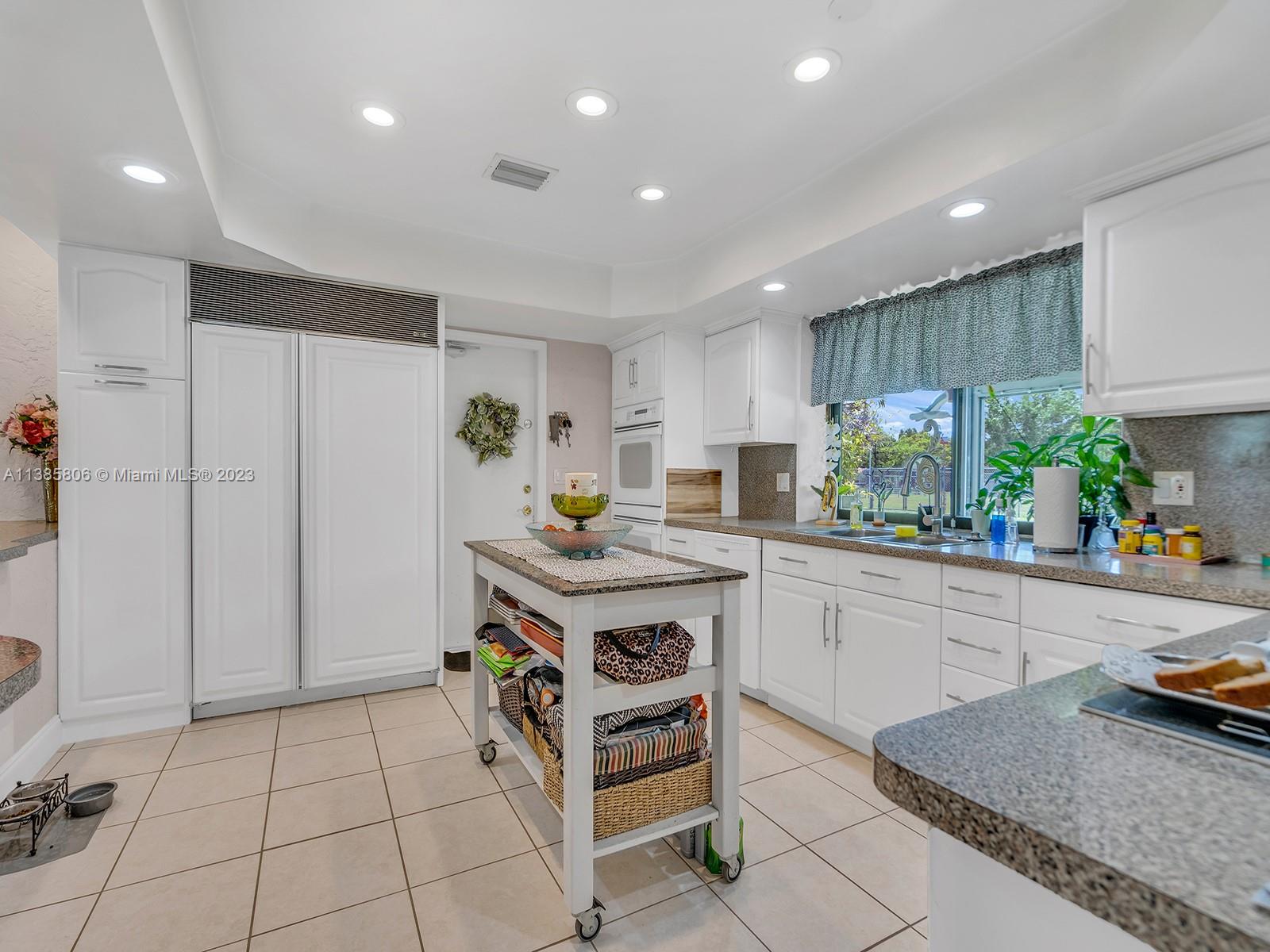 14900 Southwest 250th Street Homestead, FL 33032 - Photo 9 of 34 a kitchen with a sink and cabinets