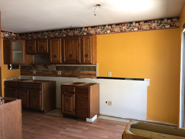 10 Winrock Road Montgomery, IL 60538 - Photo 2 of 19 a kitchen with a refrigerator and a sink