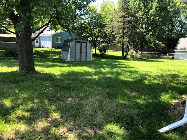 10 Winrock Road Montgomery, IL 60538 - Photo 18 of 19 a view of a house with a big yard and large trees