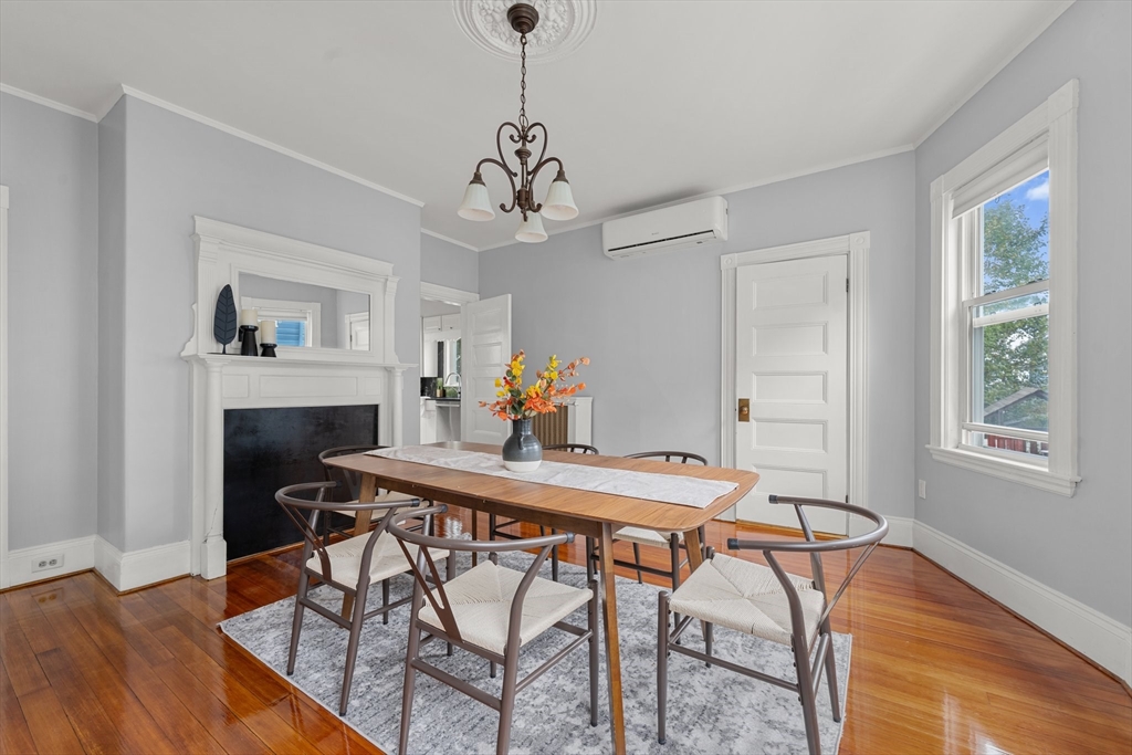 29 Garnet Road Boston, MA 02132 - Photo 11 of 42 a view of a dining room with furniture and wooden floor