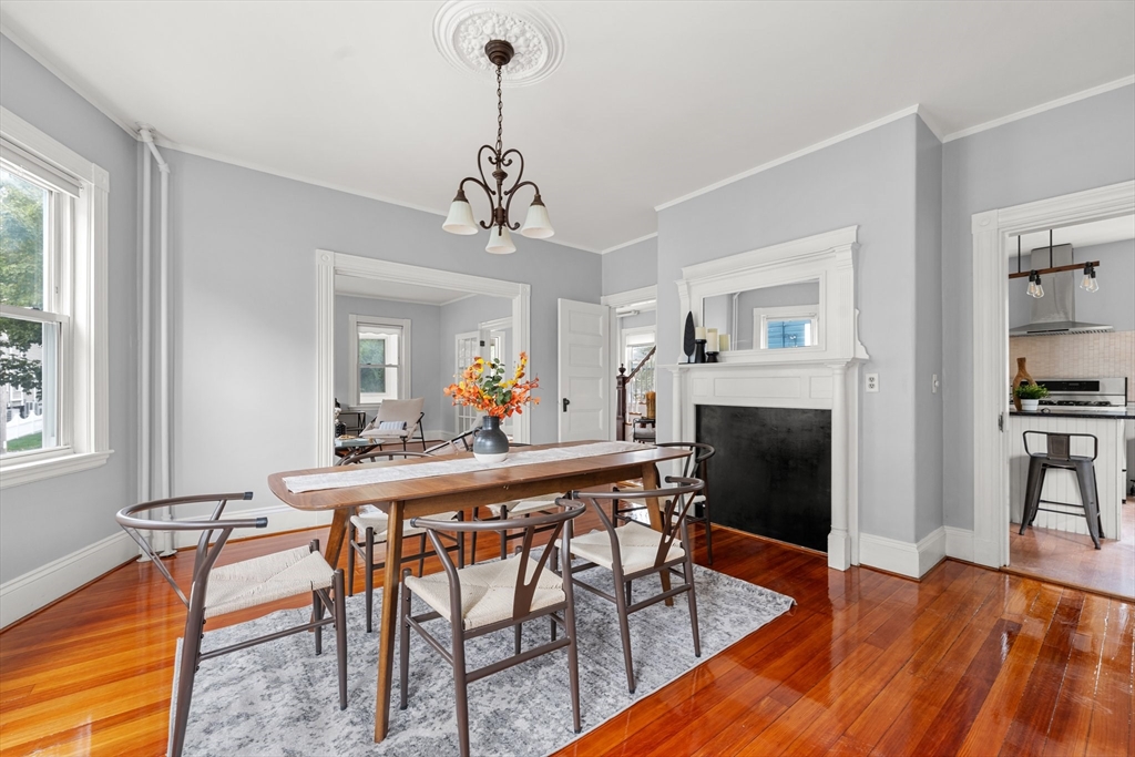 29 Garnet Road Boston, MA 02132 - Photo 12 of 42 a view of a dining room with furniture and wooden floor
