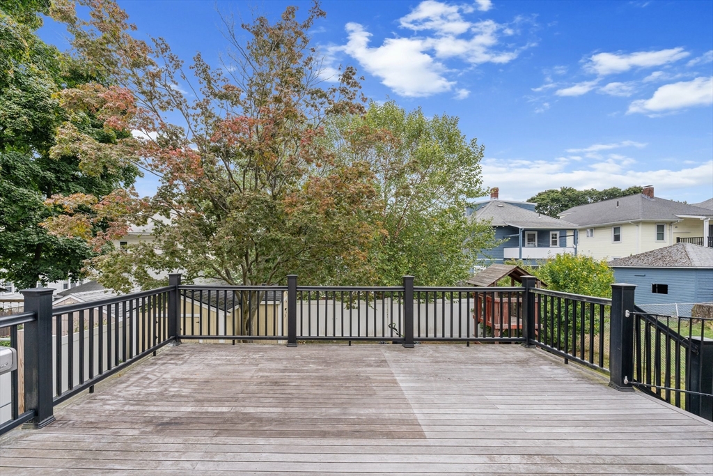 29 Garnet Road Boston, MA 02132 - Photo 18 of 42 a view of a deck and a yard