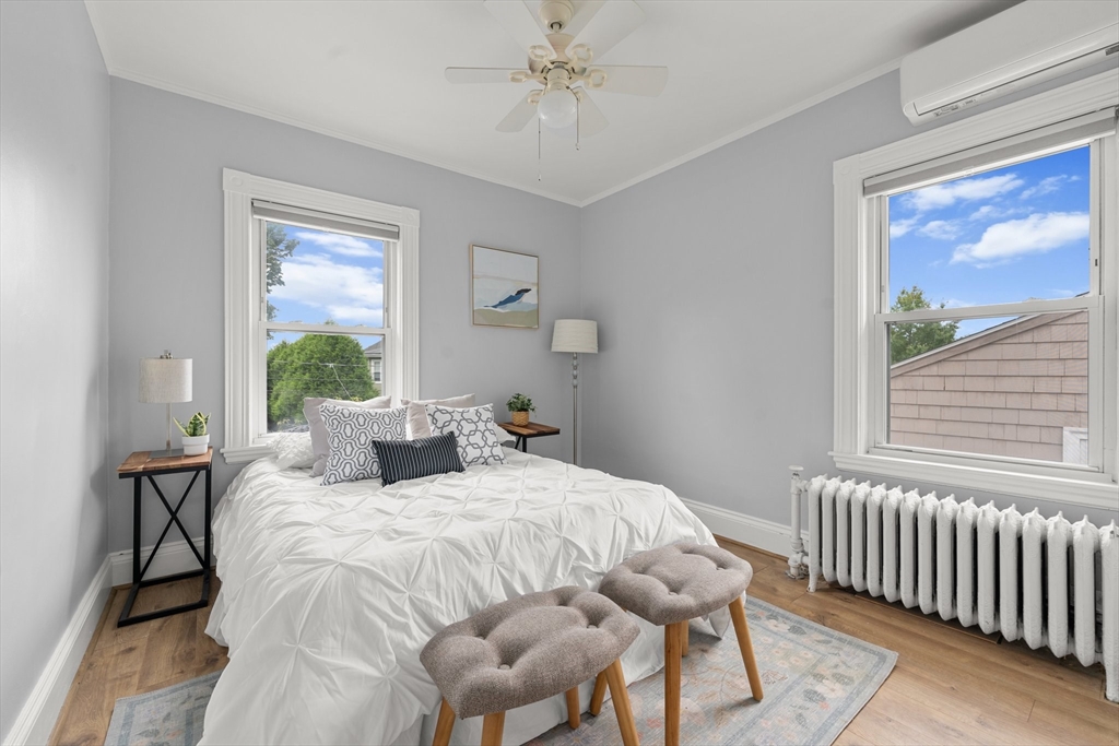 29 Garnet Road Boston, MA 02132 - Photo 22 of 42 a bedroom with a bed and a large window