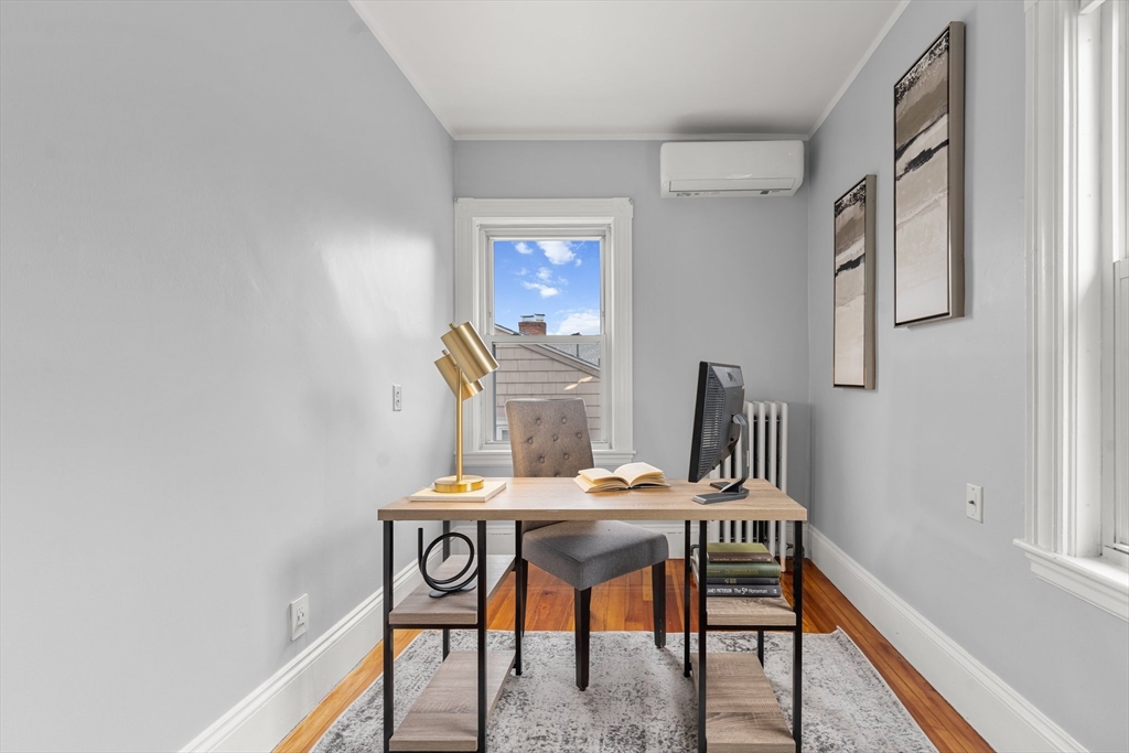 29 Garnet Road Boston, MA 02132 - Photo 30 of 42 a view of a dining room with furniture and wooden floor