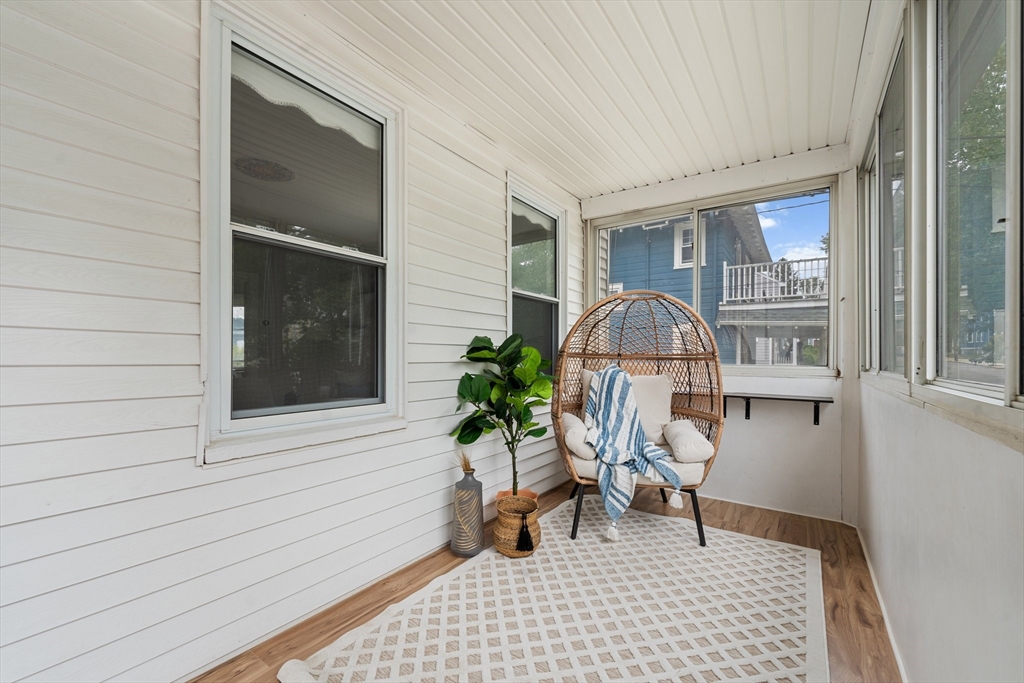 29 Garnet Road Boston, MA 02132 - Photo 3 of 42 a porch with seating space and a potted plant