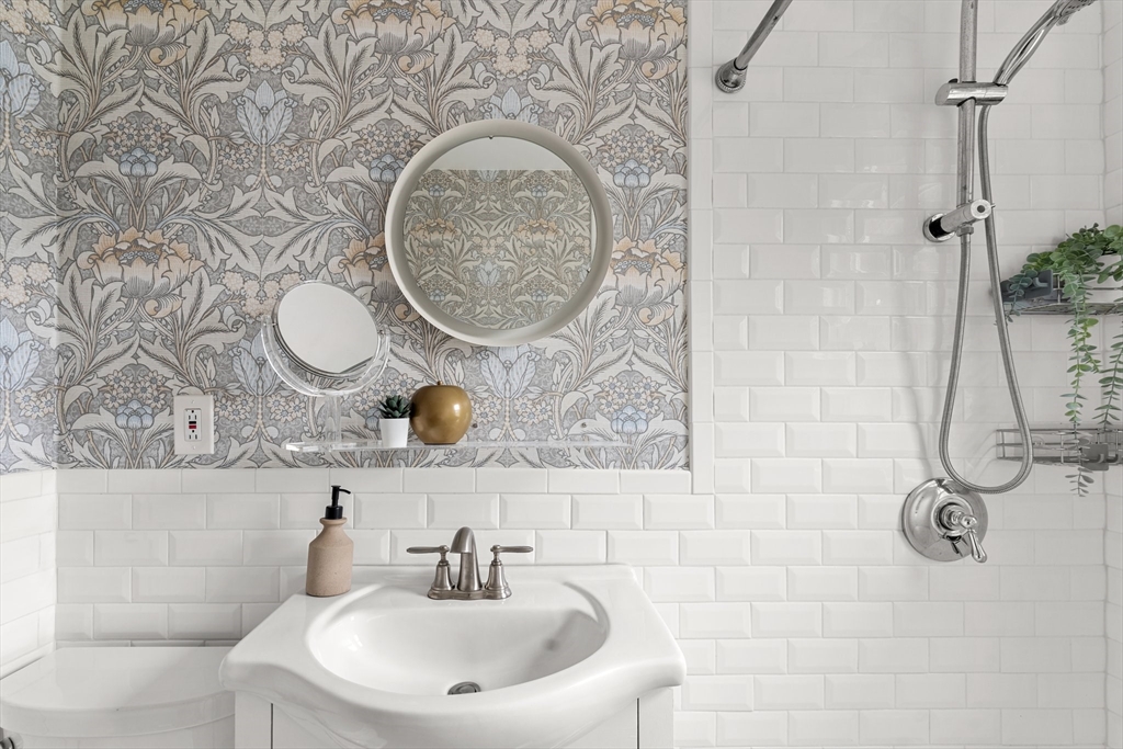 29 Garnet Road Boston, MA 02132 - Photo 34 of 42 a bathroom with a sink and a mirror