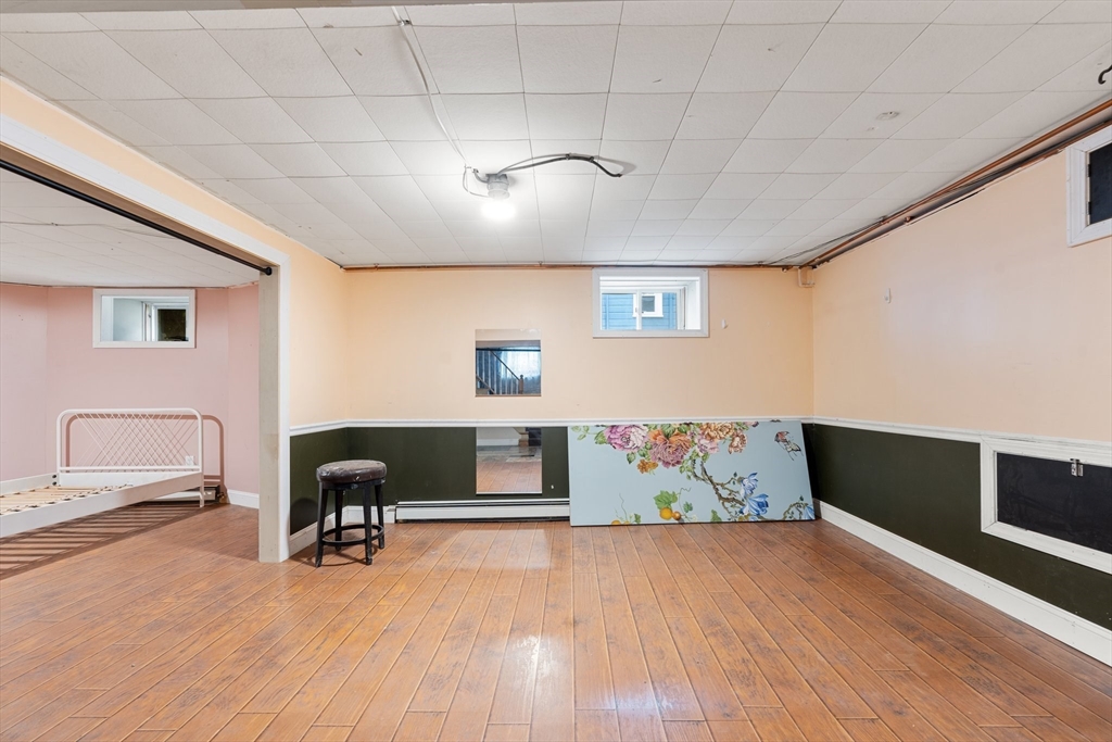 29 Garnet Road Boston, MA 02132 - Photo 36 of 42 a workspace with furniture wooden floor and window