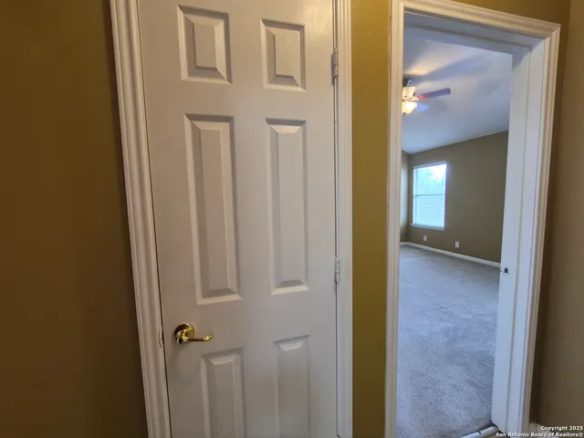 a view of a bathroom from a hallway