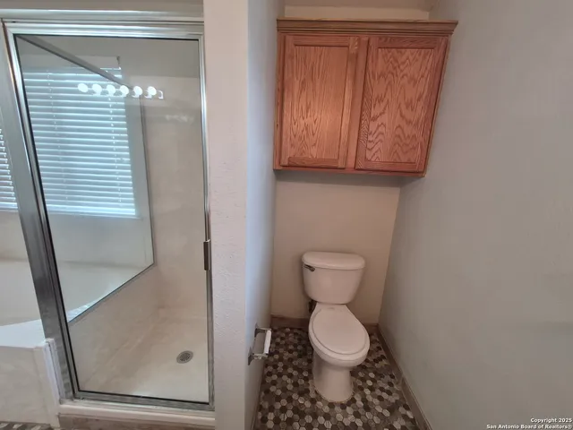 a bathroom with a toilet and a sink