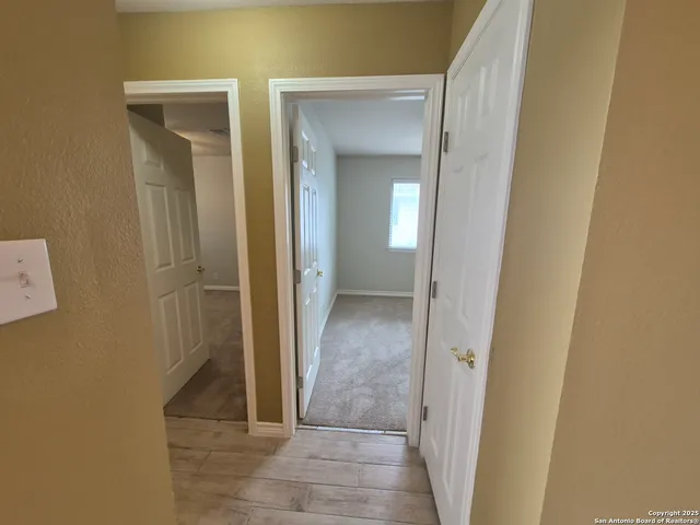 hallway view with wooden floor
