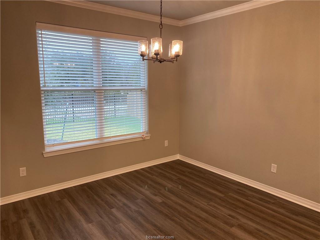 6434 Raleigh Drive College Station, TX 77845 - Photo 11 of 32 a view of a room with wooden floor and windows