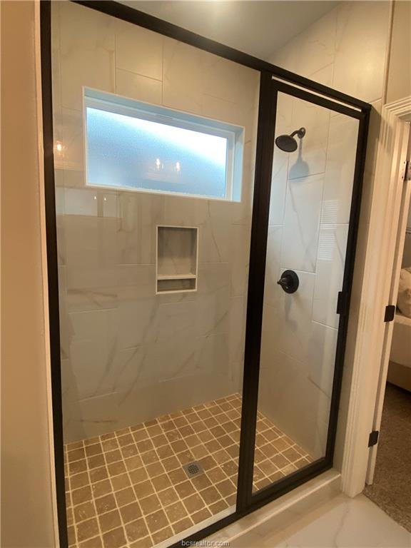 6434 Raleigh Drive College Station, TX 77845 - Photo 15 of 32 a bathroom with a shower