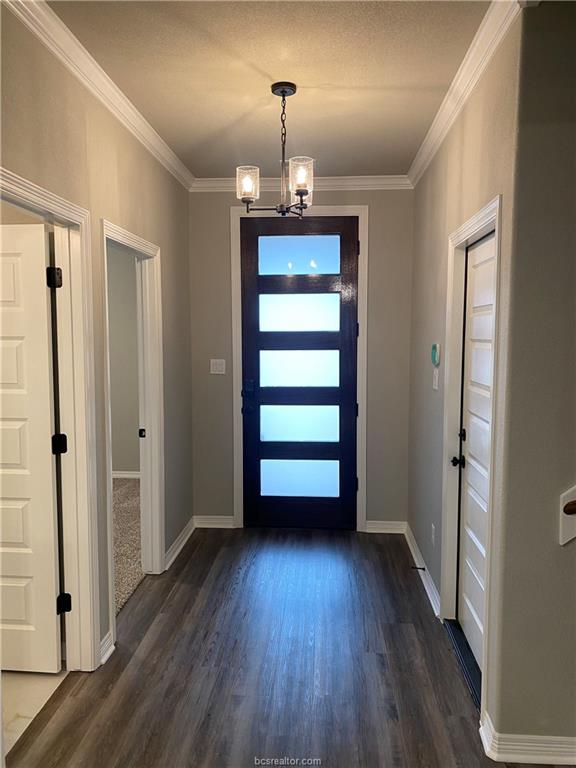 6434 Raleigh Drive College Station, TX 77845 - Photo 2 of 32 an empty room with wooden floor staircase and windows