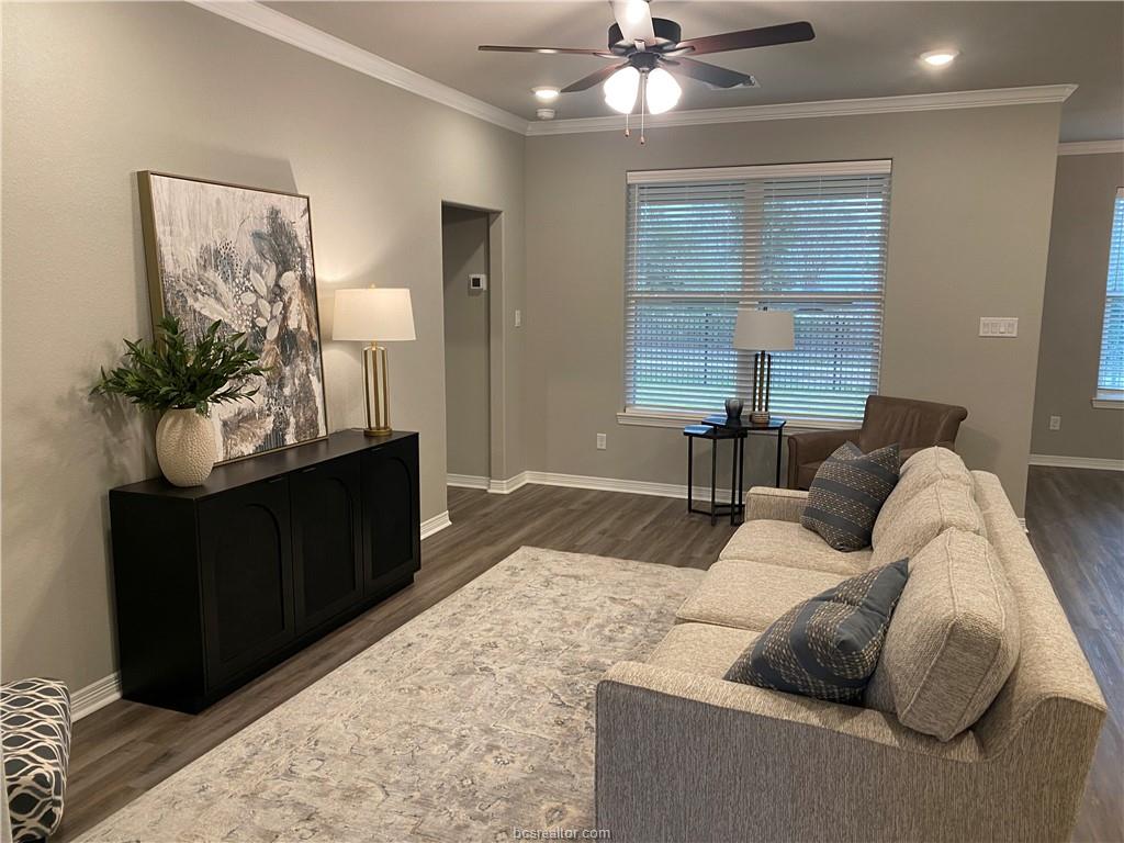 6434 Raleigh Drive College Station, TX 77845 - Photo 5 of 32 a living room with furniture and a chandelier