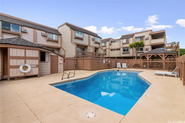 a view of a living room and kitchen