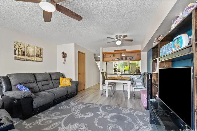a living room with furniture fireplace and a flat screen tv