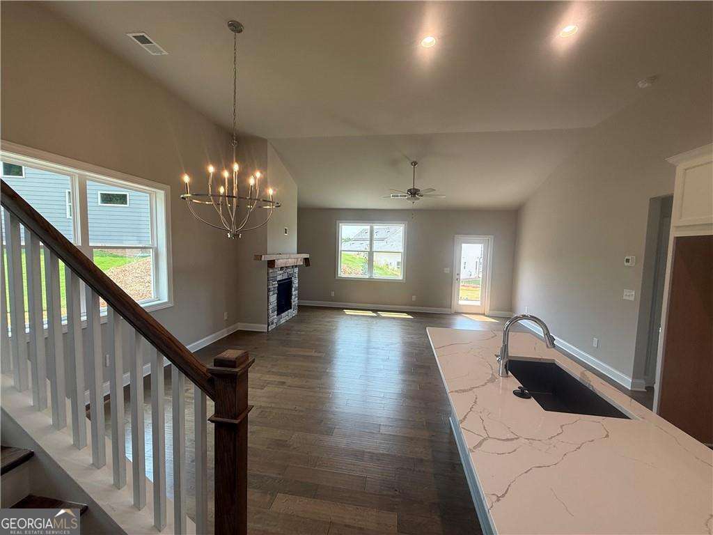352 Lakeside Drive Canton, GA 30115 - Photo 6 of 16 a view of a hallway with wooden floor and staircase