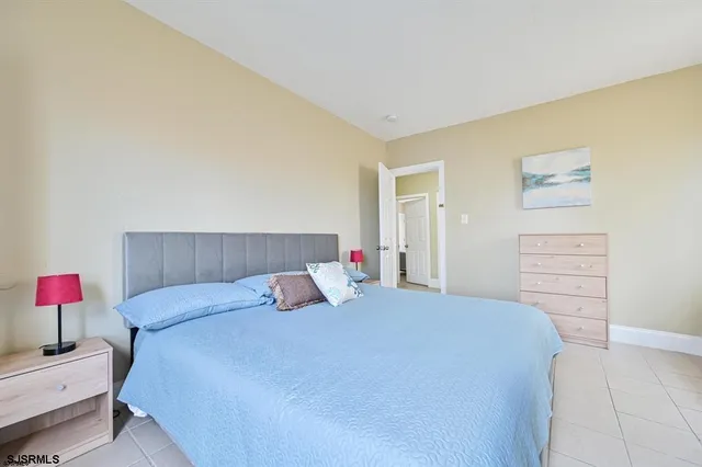 a bedroom with a bed and a cabinets